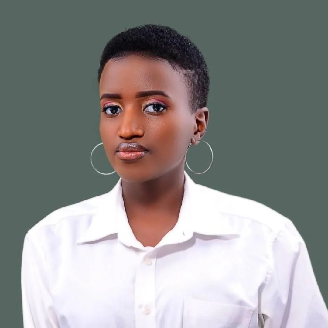 Female company finance manager with short hair in white shirt and green background.