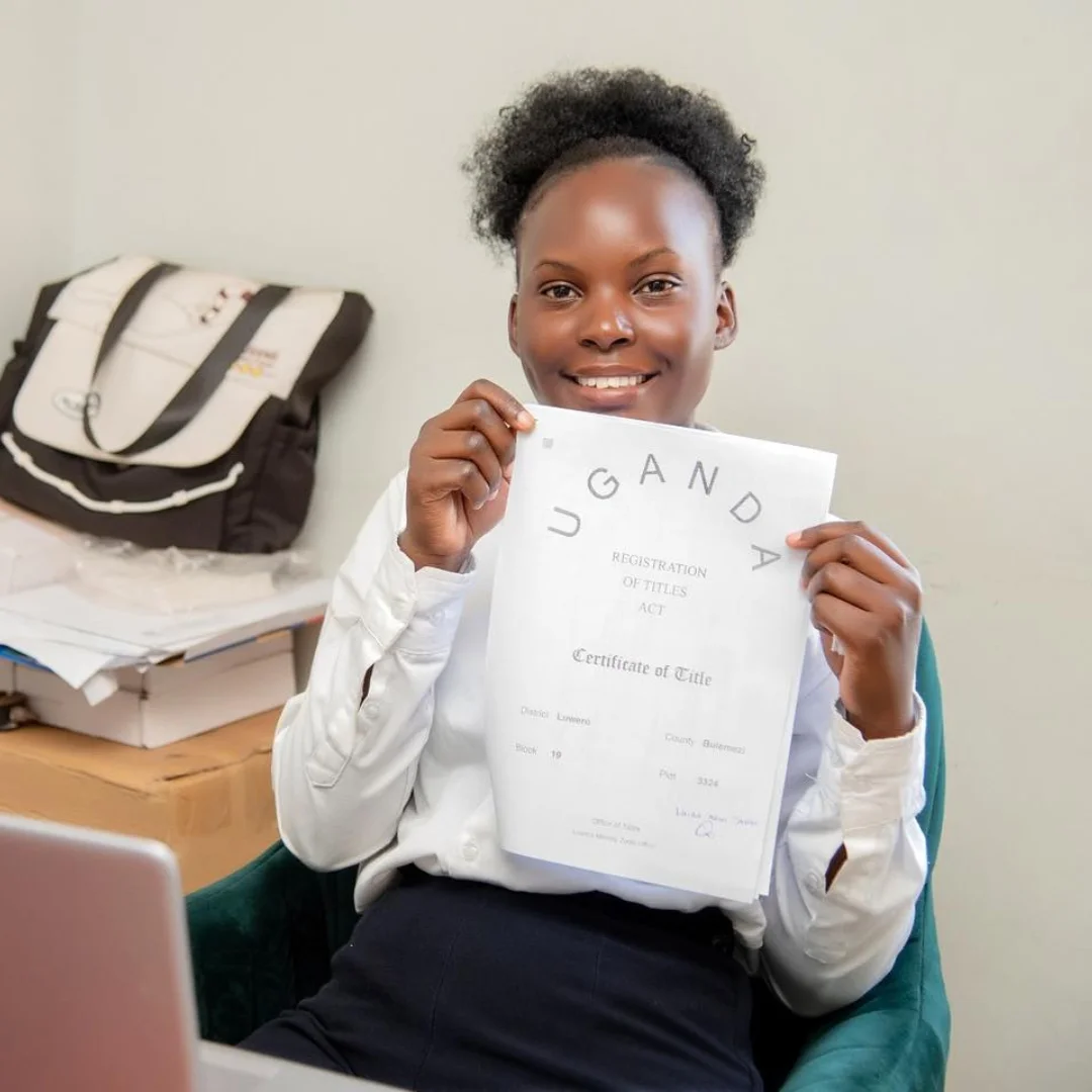 Female company surveyor holding a land title.